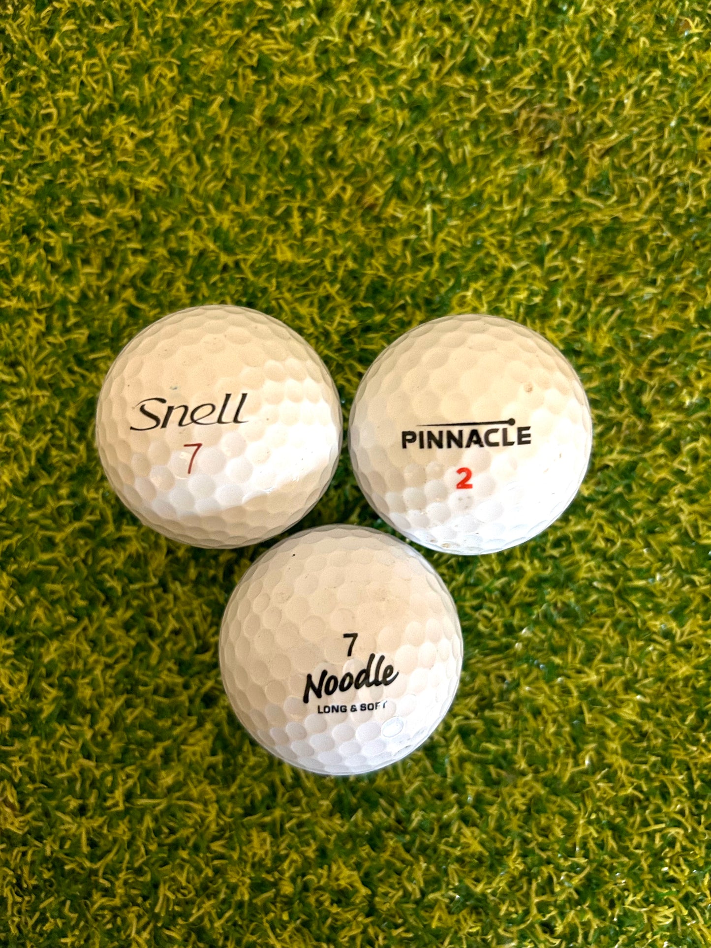 12 white assorted golf balls