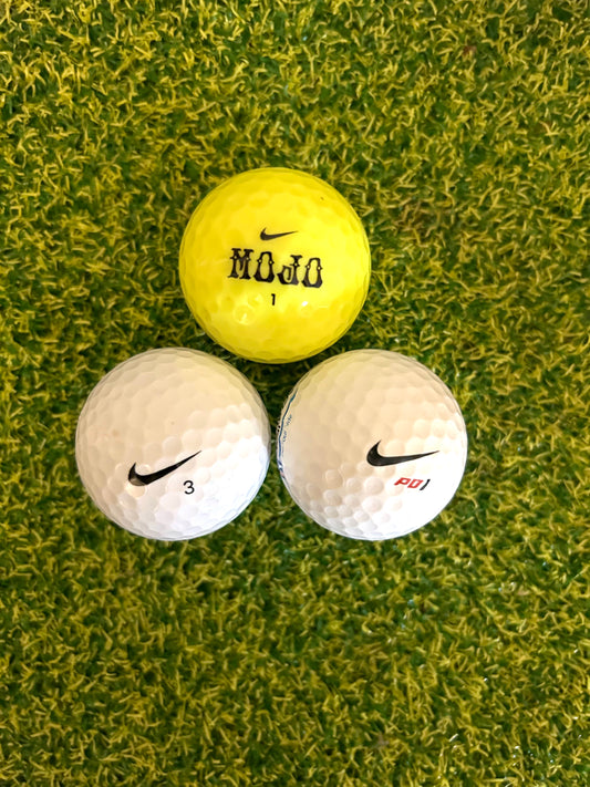 12 assorted Nike golf balls